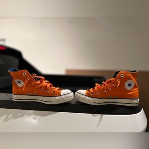 Orange high top Converse.  Size 4 men’s (6 in women’s).
